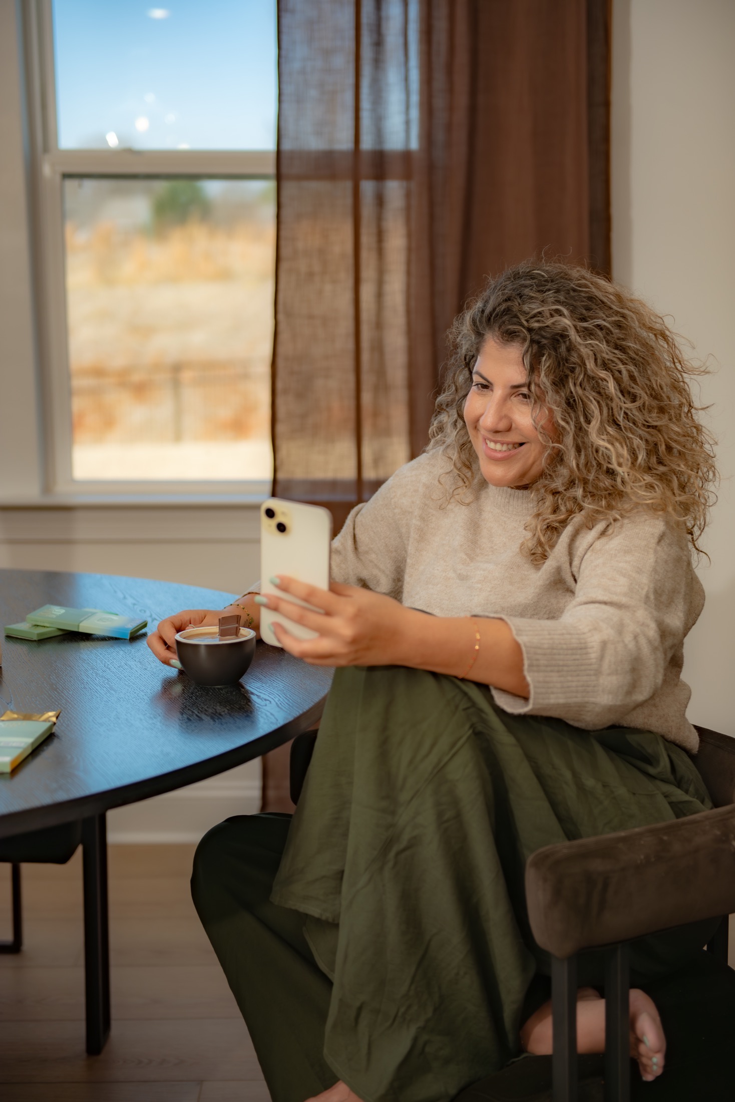 Coffee brand founder creating social media content with her product