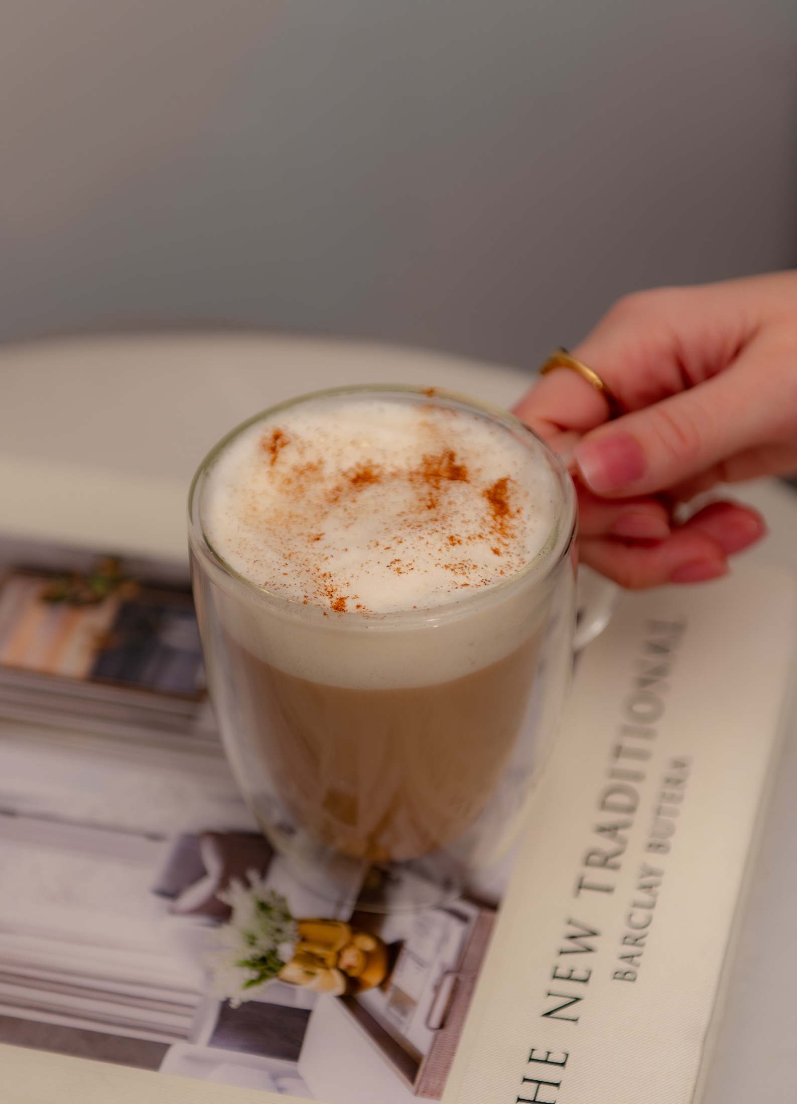 Styled latte and editorial magazine detail for a coffee brand content library