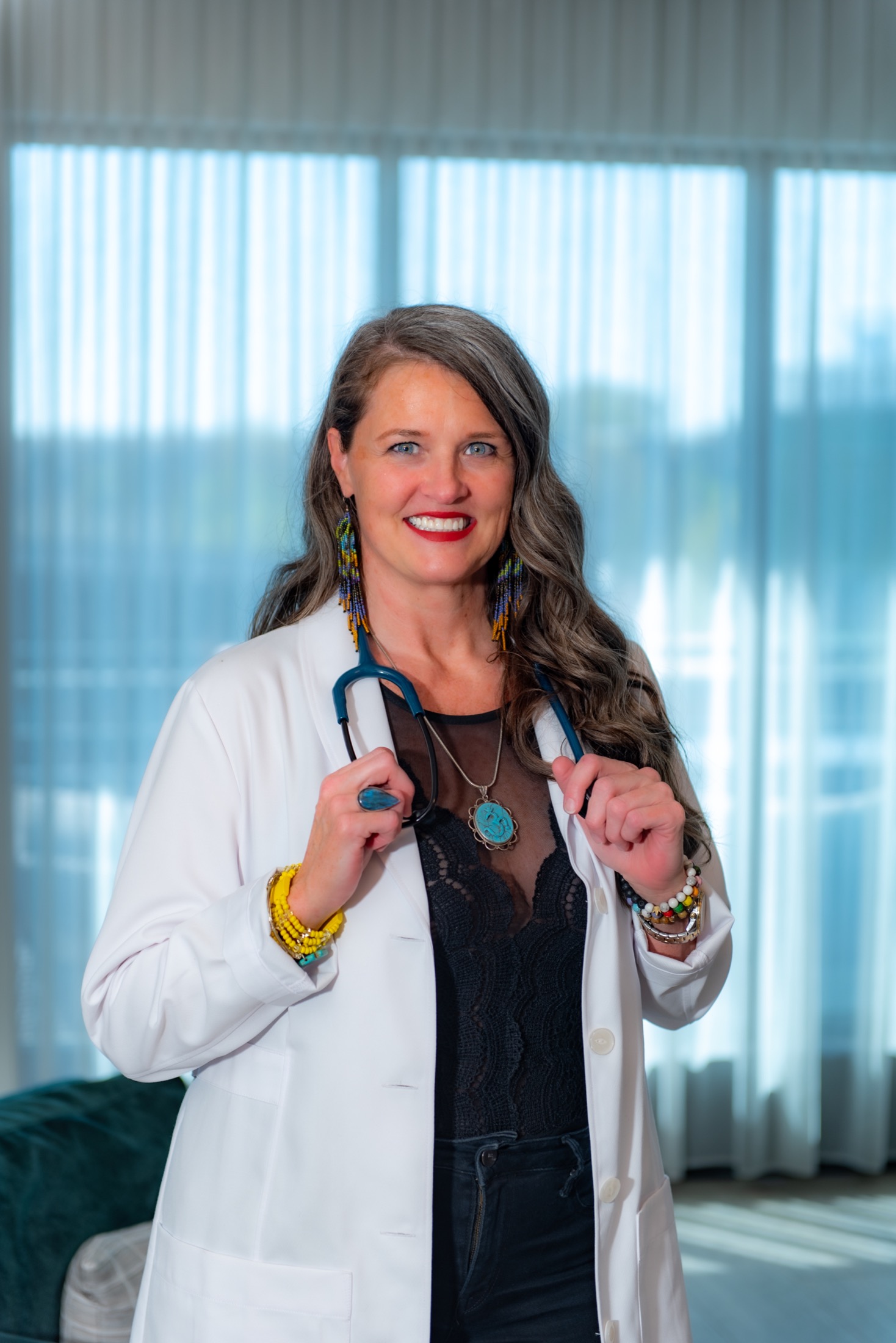 Healthcare professional wearing a white coat and stethoscope for a brand portrait