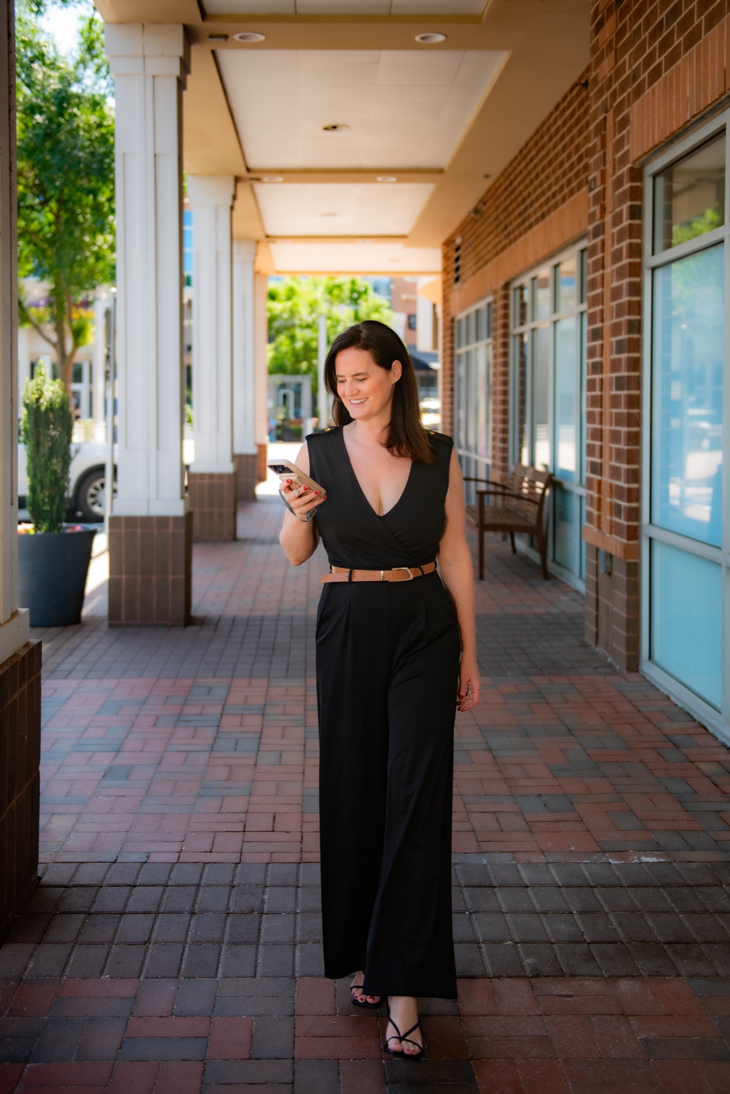 South Florida entrepreneur photographed using her phone during a personal brand session