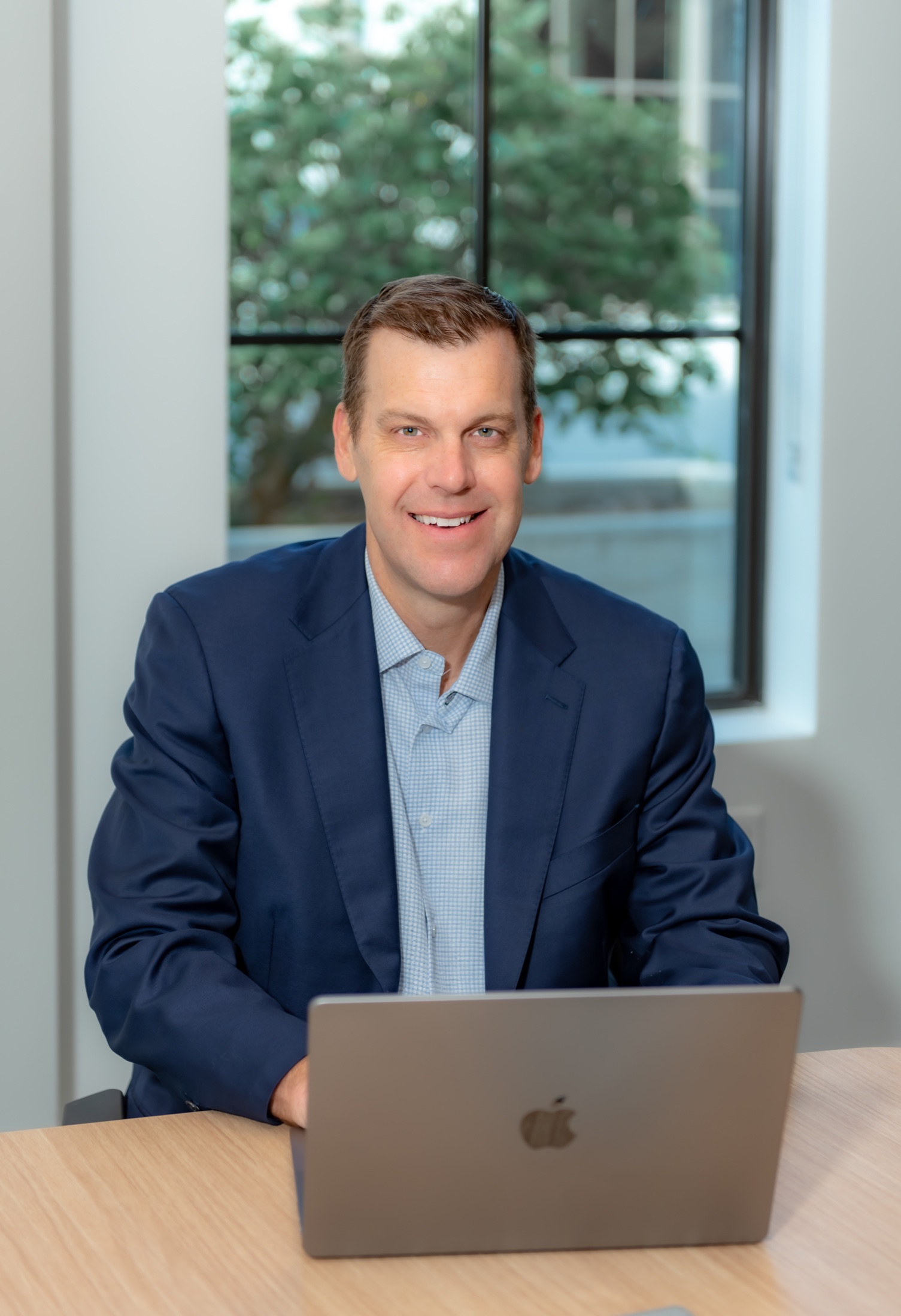 Business professional photographed with his laptop during a brand session