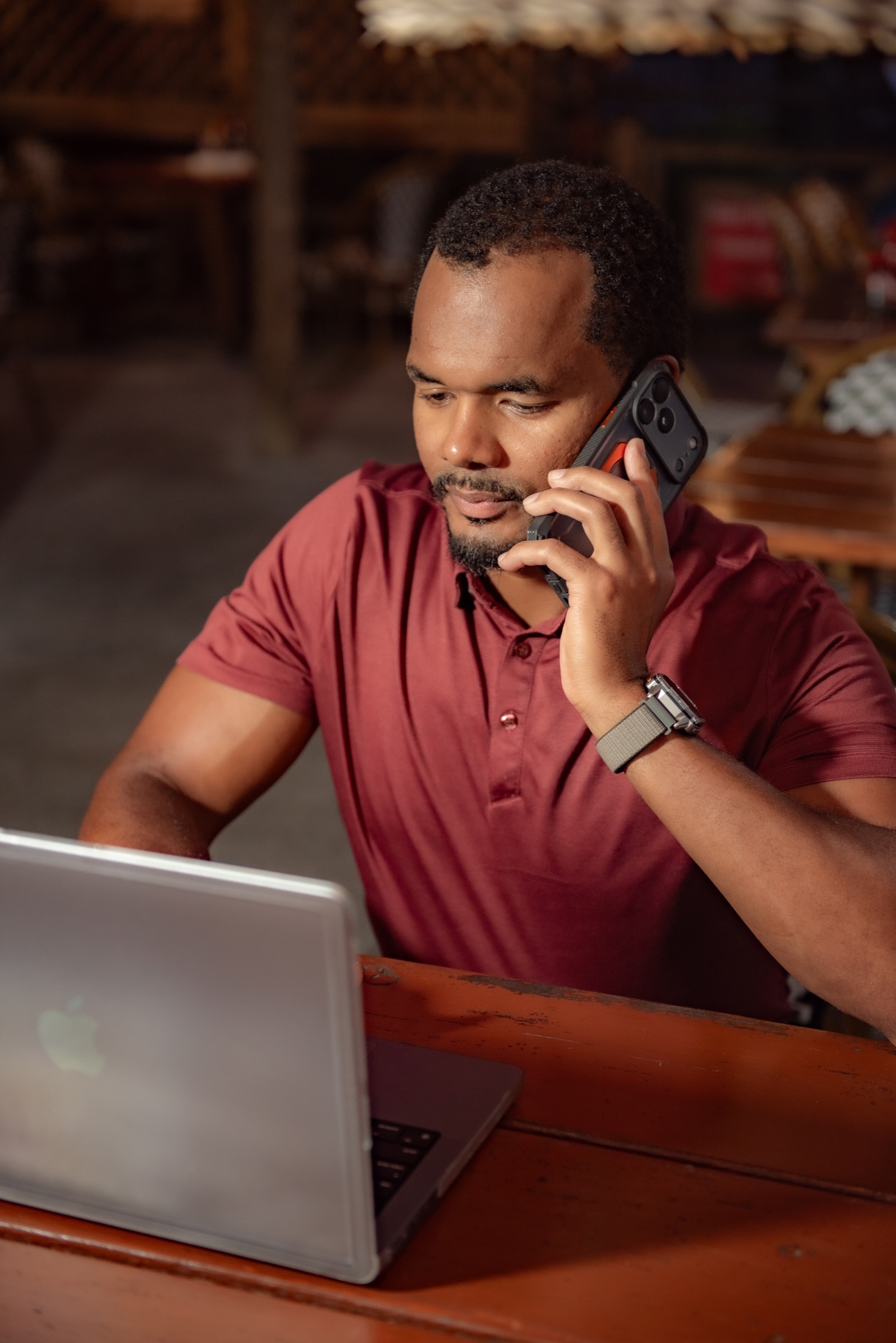 Business professional working on his laptop and phone during a lifestyle brand session