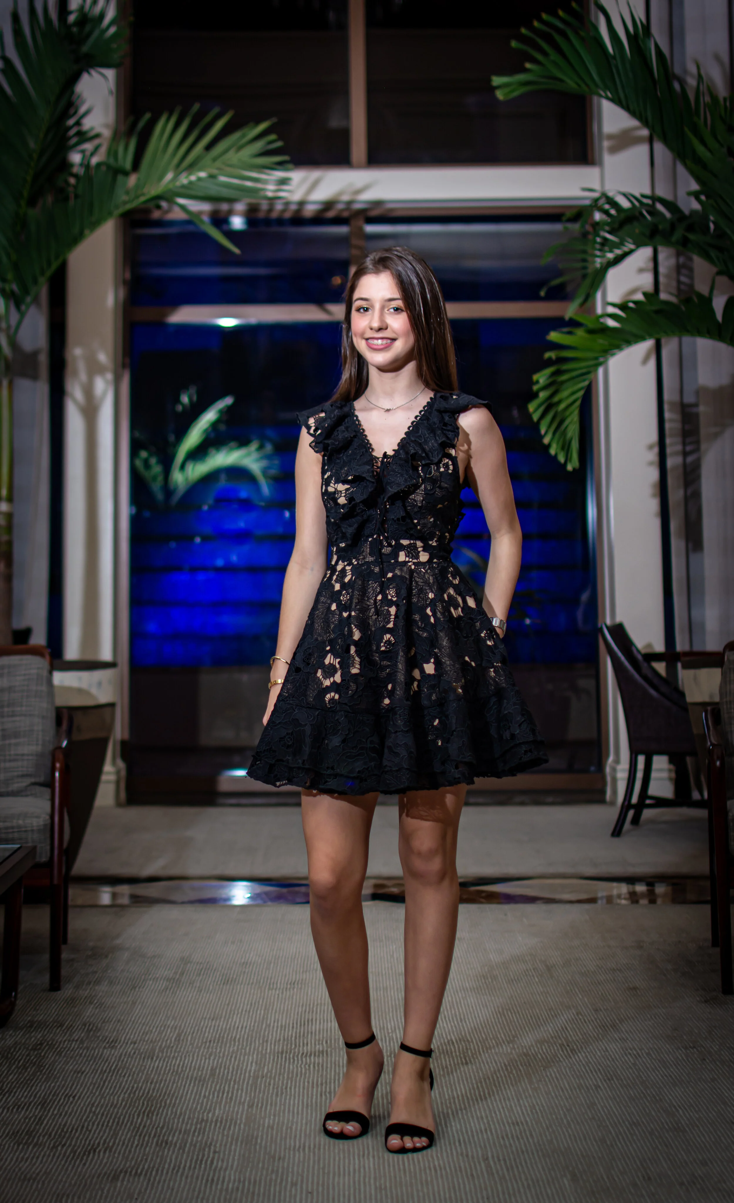 Quinceañera in a black lace dress photographed at her South Florida celebration