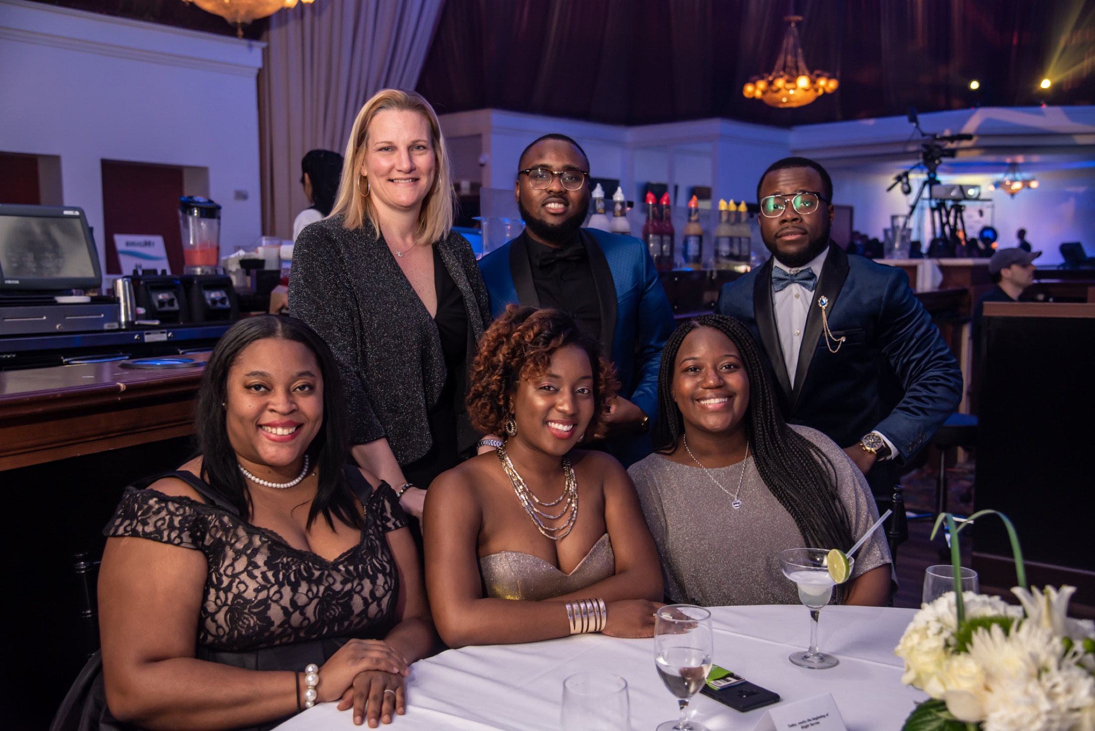 Colleagues posing together at a company awards dinner