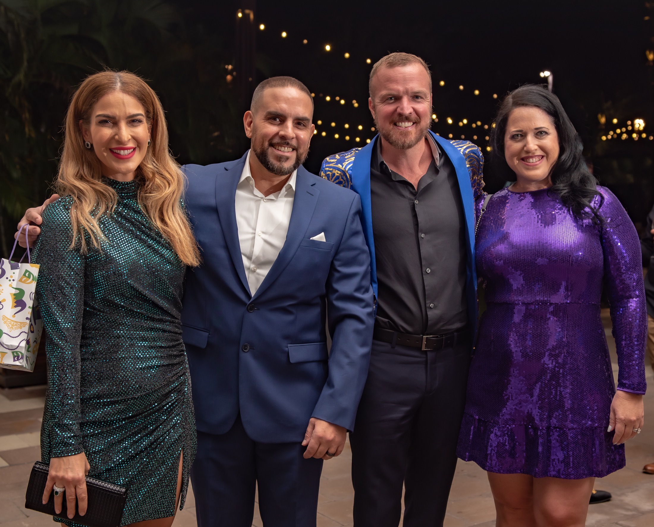 Colleagues posing together during a South Florida company gala