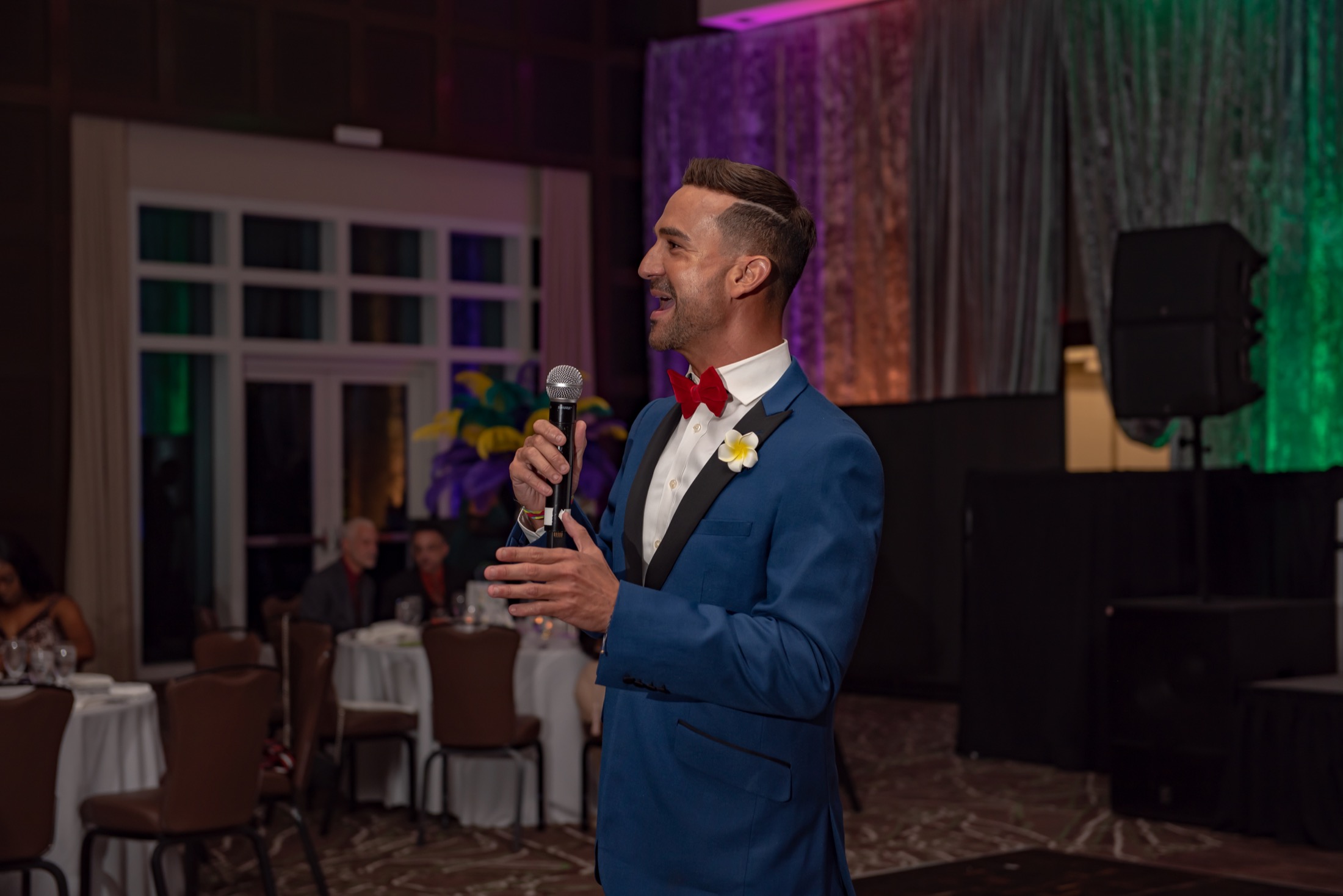 Emcee speaking during a South Florida corporate gala