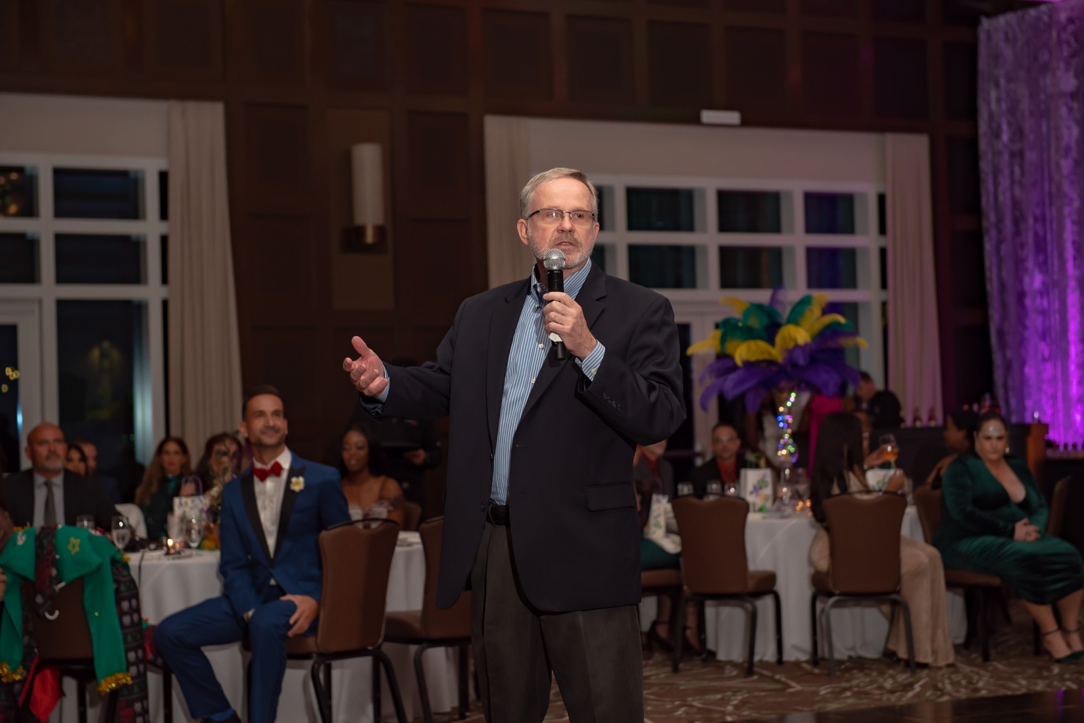 Business leader speaking to attendees at a company gala