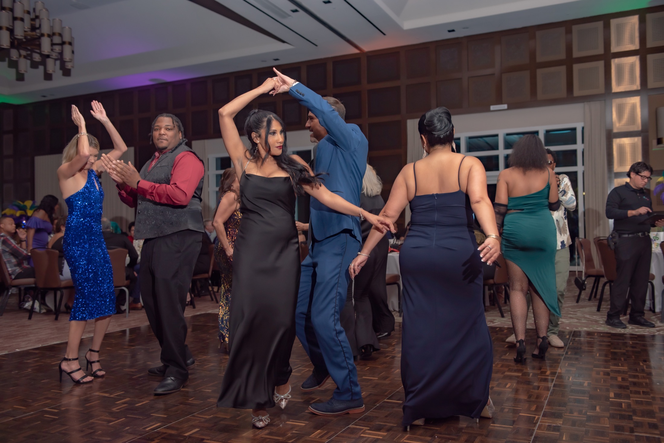 Colleagues dancing during a company gala reception